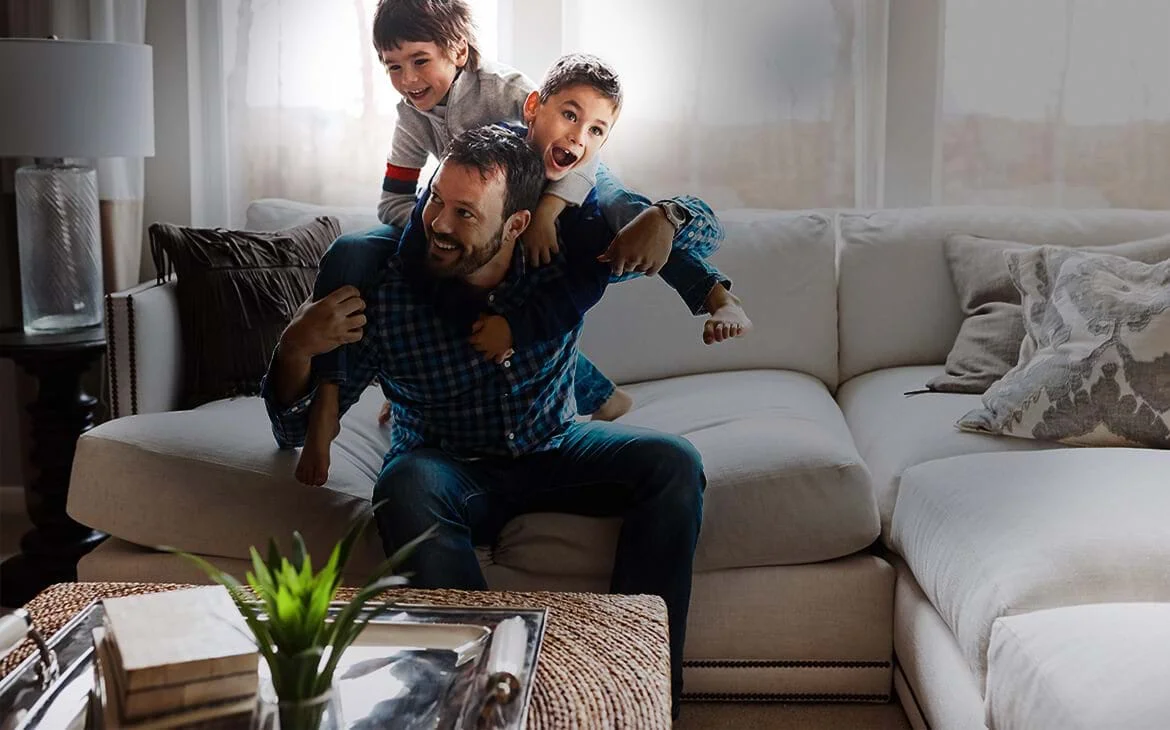 a family sitting on a couch