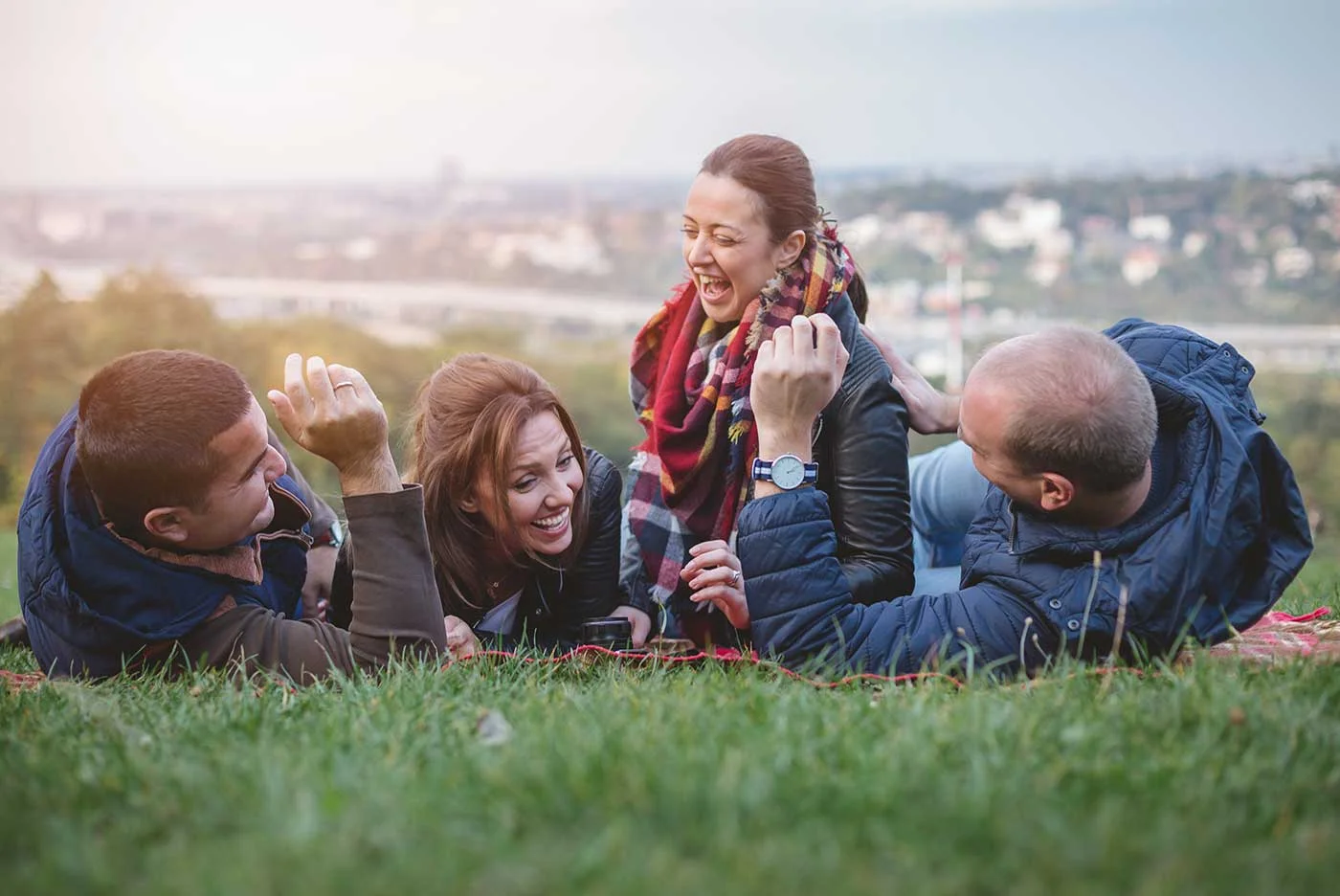 A family laying down in a field