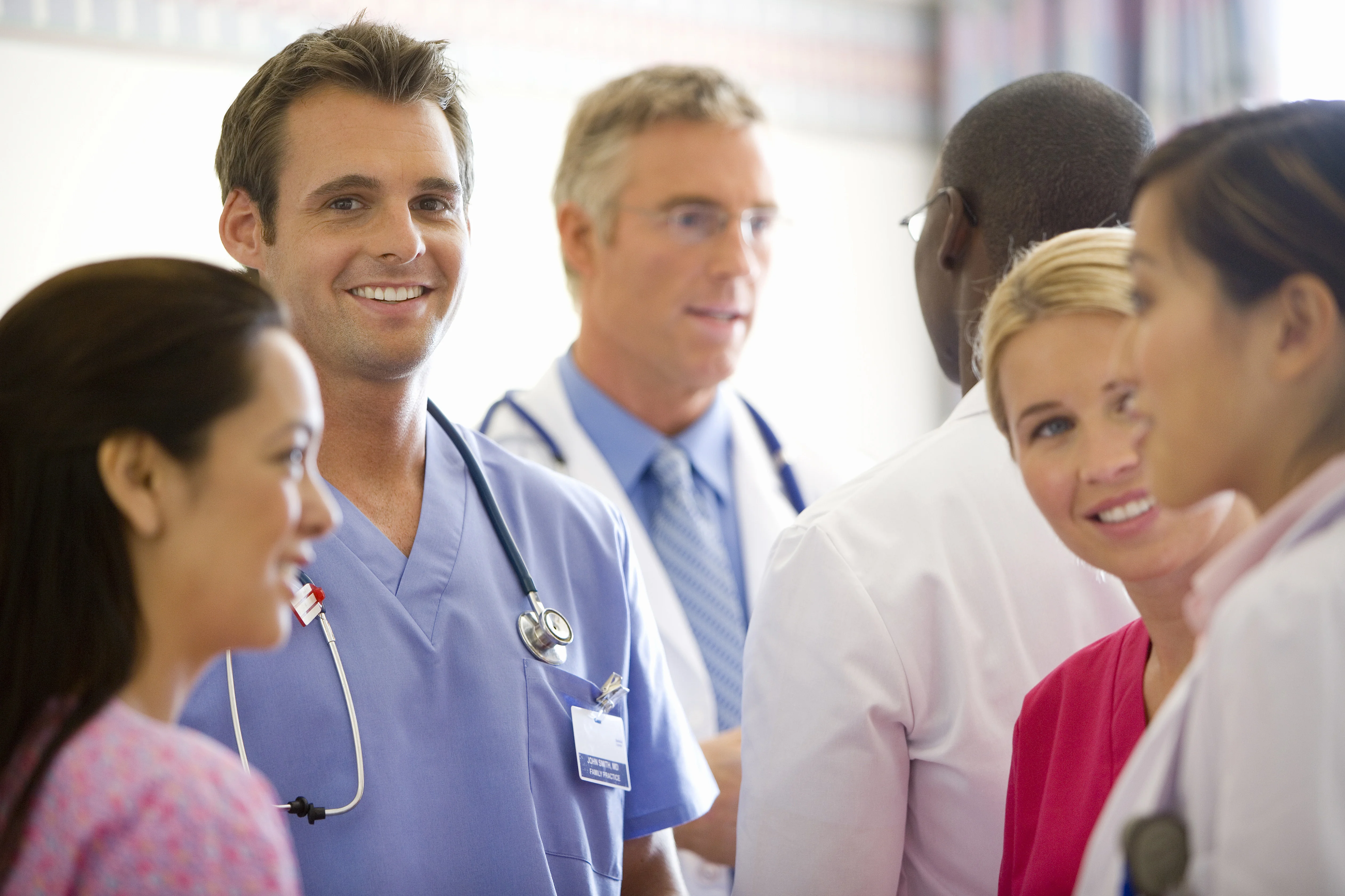 a group of people in white shirts