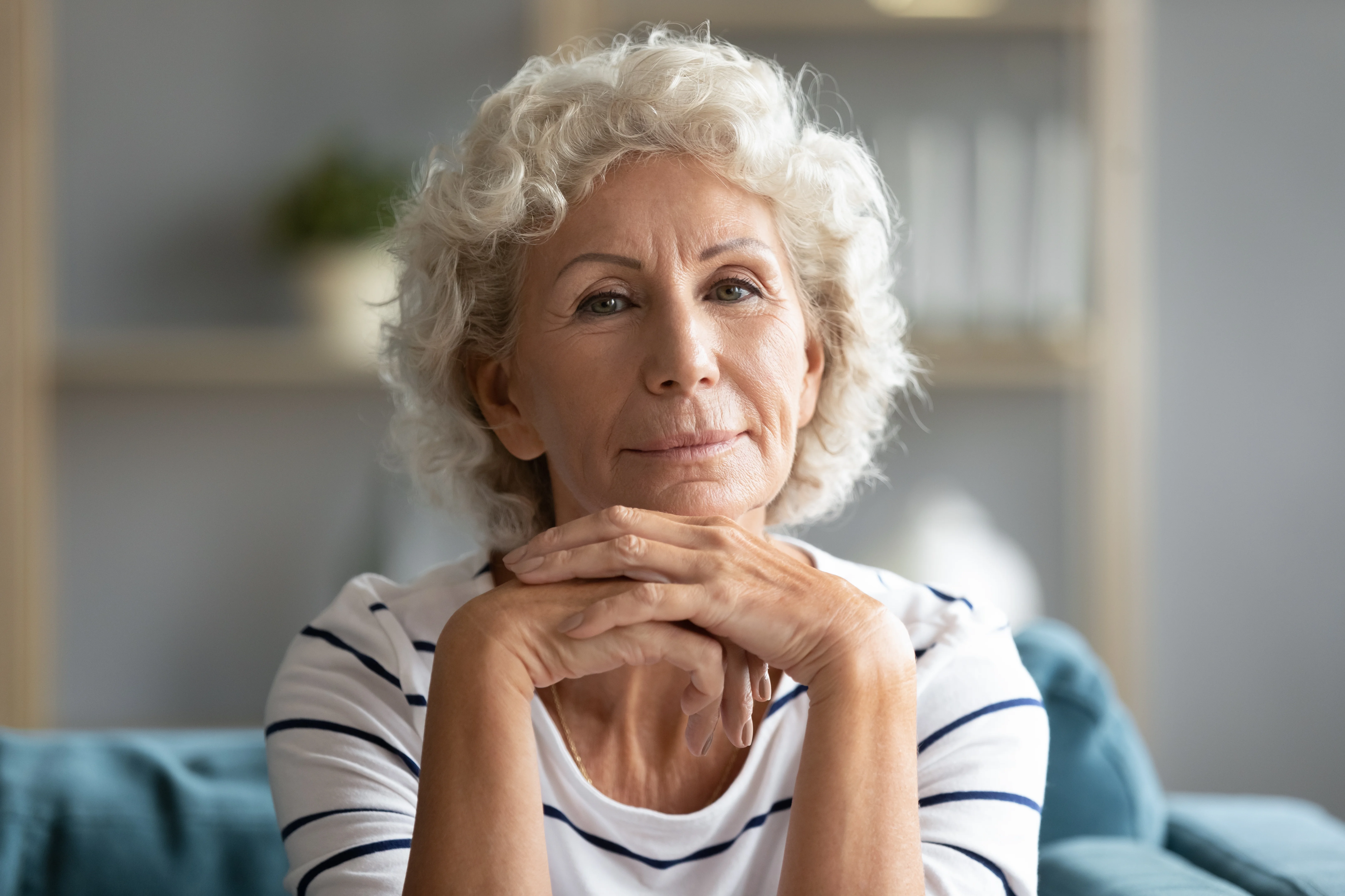a woman with her hand on her chin