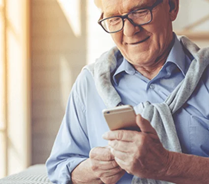 An eldery man on his mobile phone