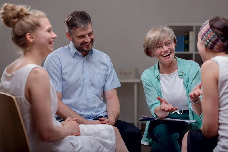 a group of people sitting and talking
