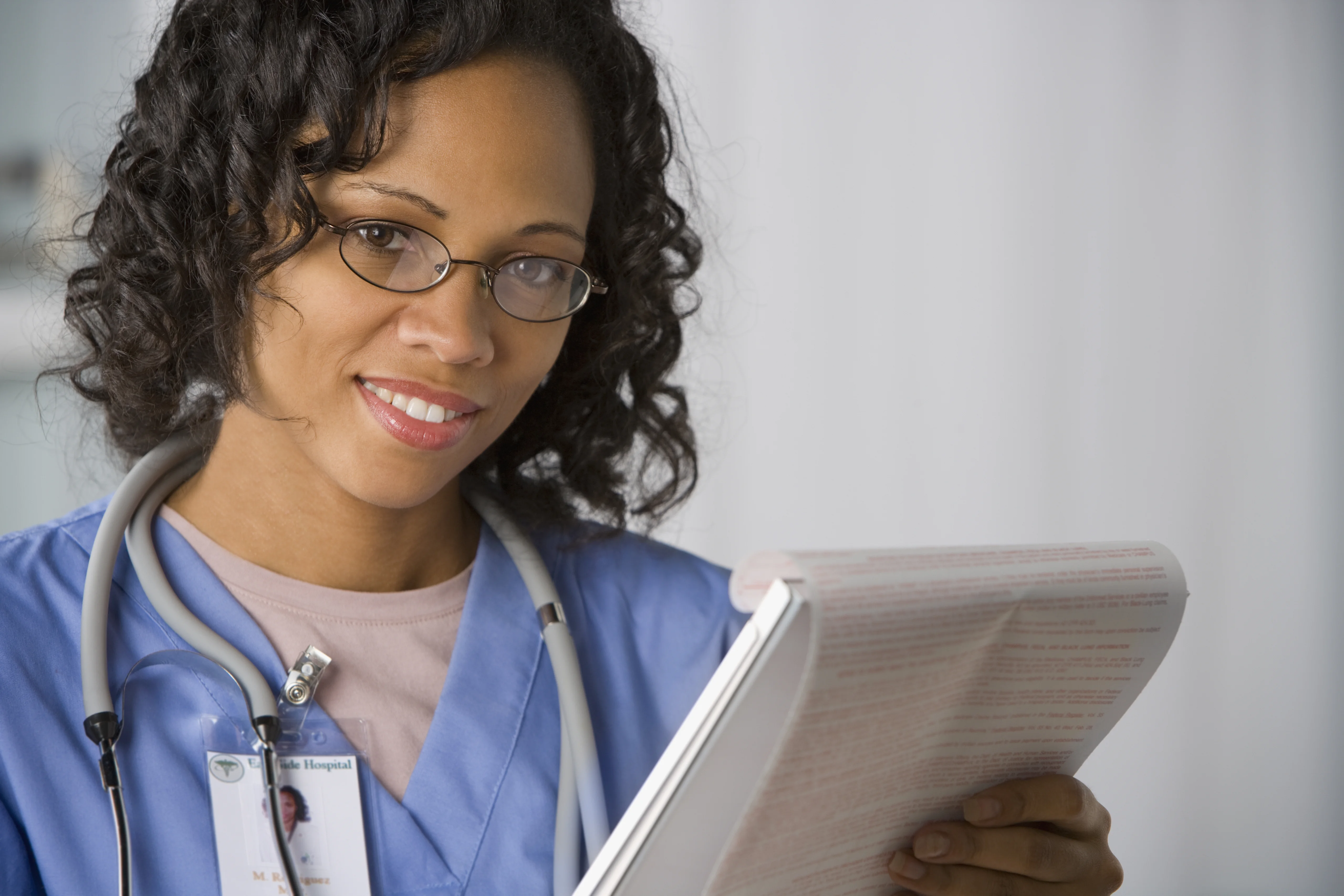 a woman holding a clipboard