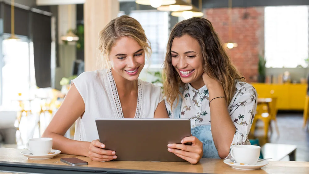 women looking at a tablet