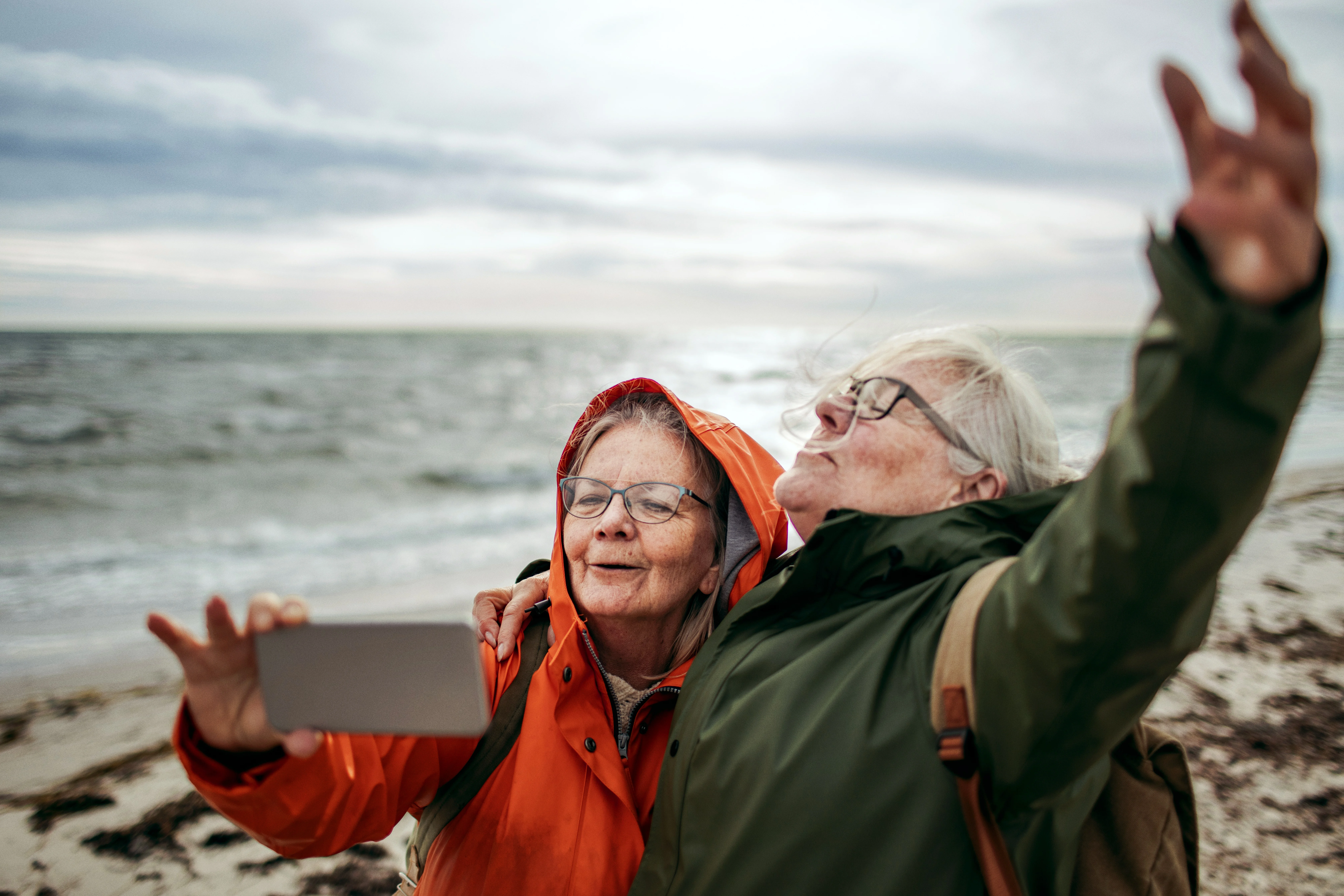 A couple taking a selfie on the beach