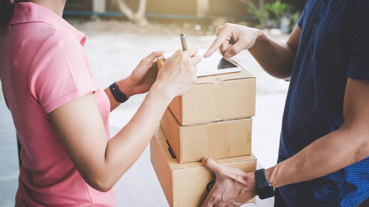 A woman accepting a home delivery