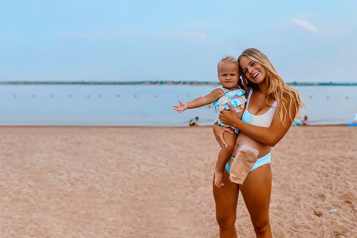 two women in swimsuits on a beach