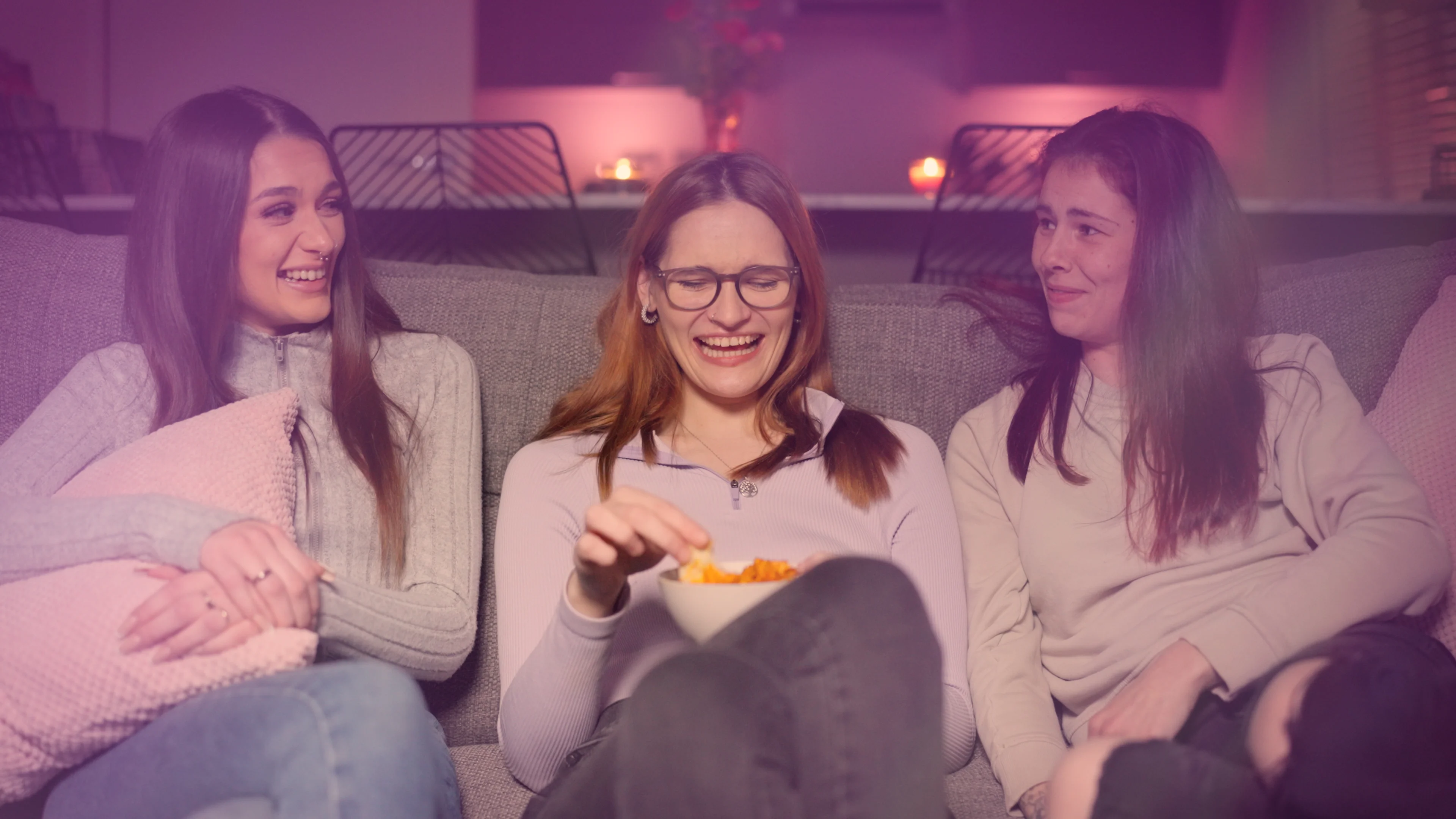a group of women sitting on a couch