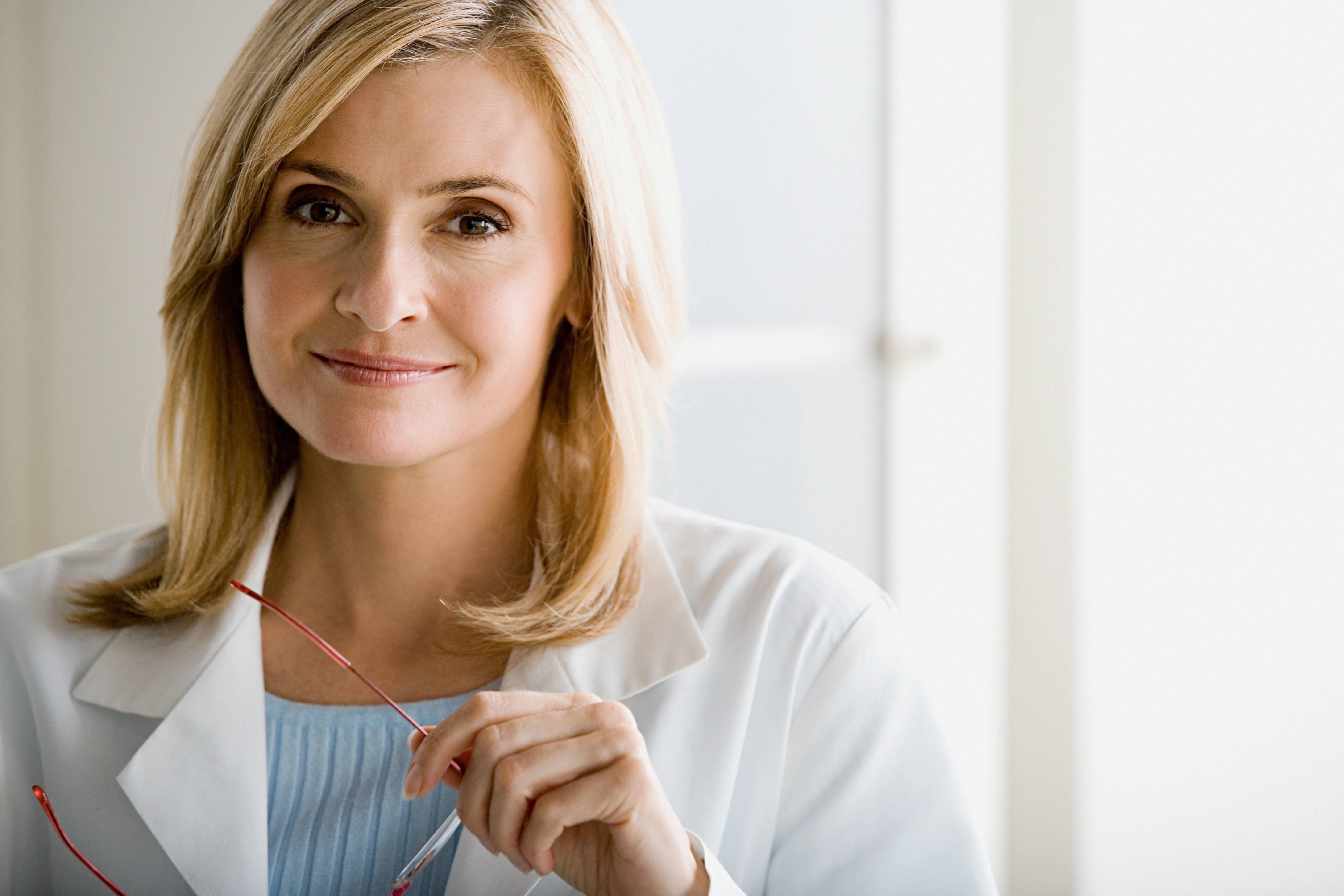 a woman with a stethoscope around her neck