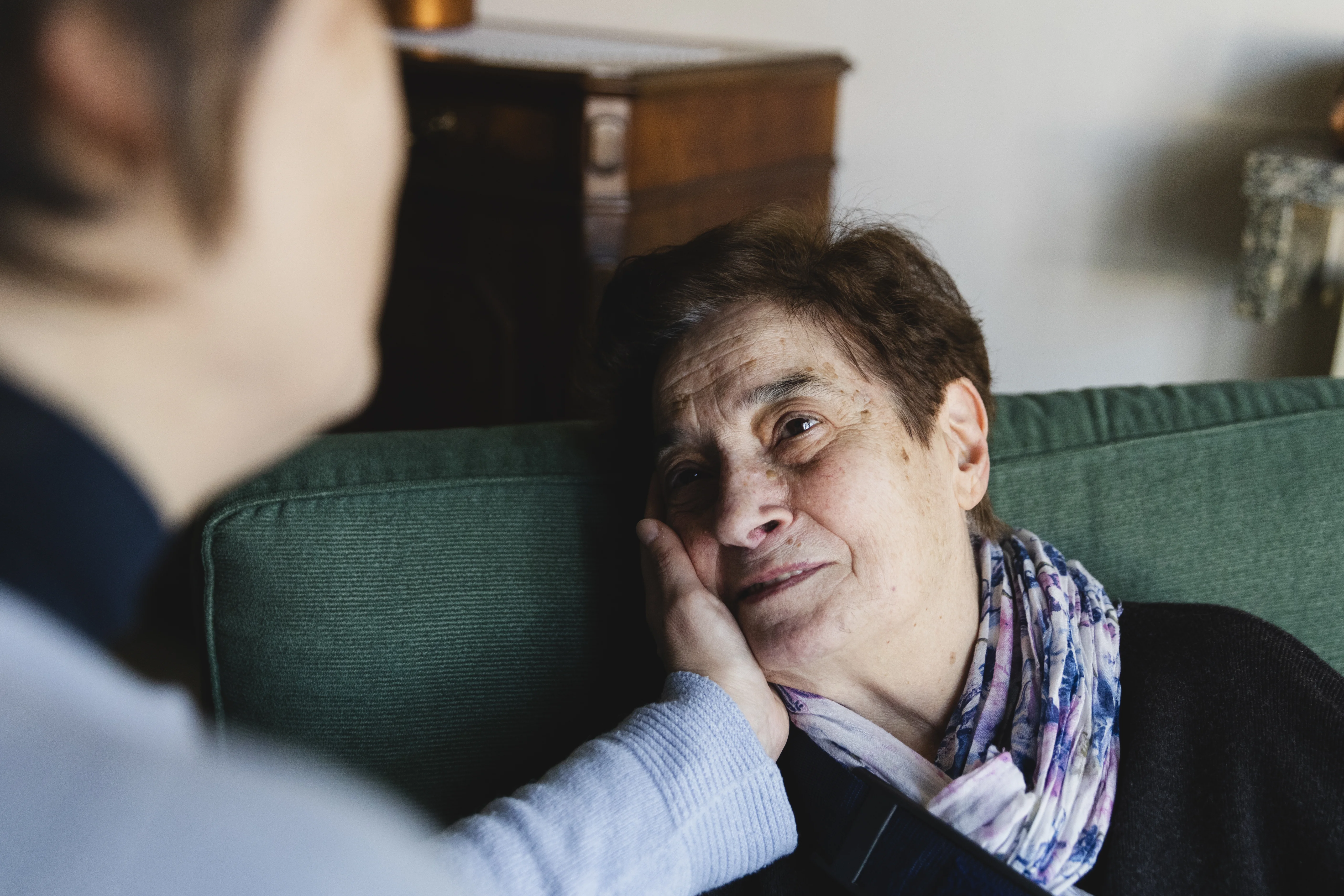 A carer comforting a patient